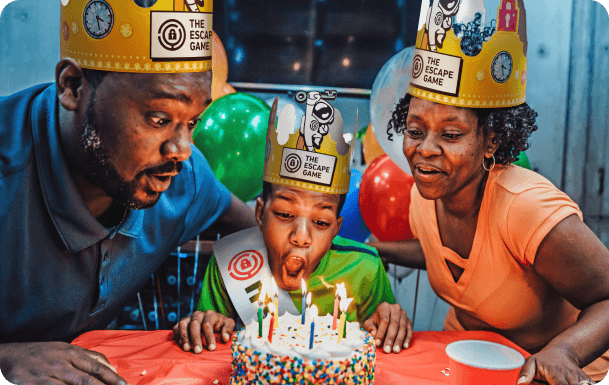 A family enjoys birthday cake at The Escape Game LA