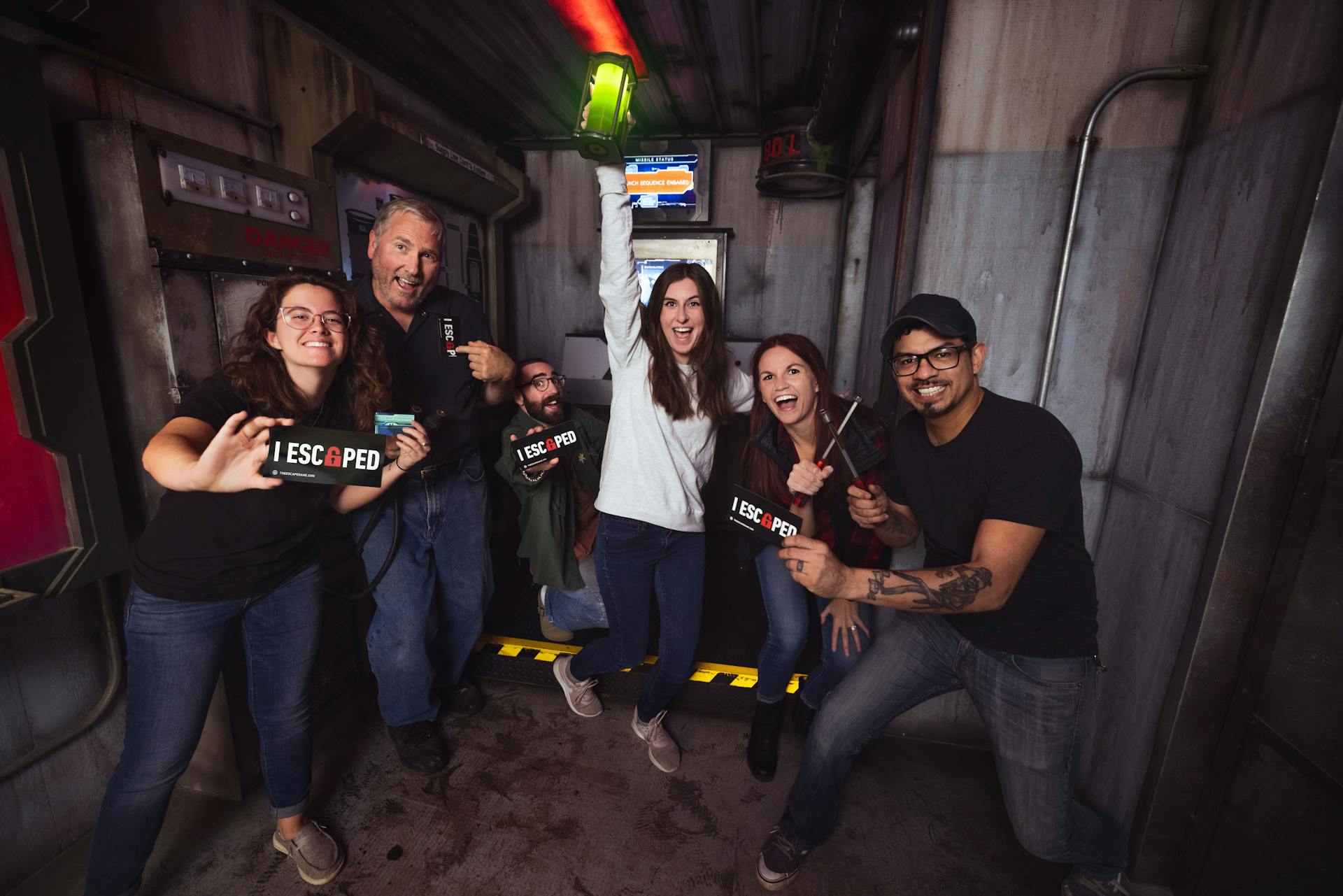 Coworkers celebrating inside an escape room