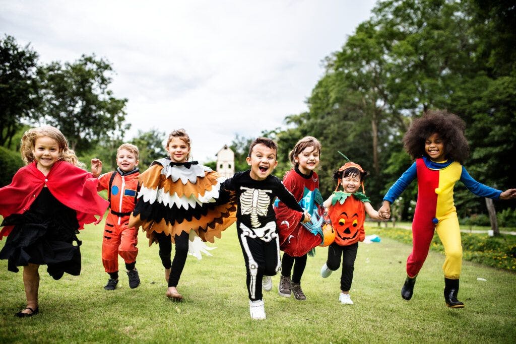 happy kids in halloween costumes